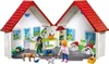 A toy veterinary clinic playset with figures and animals. Produktbild-Vorschau