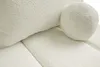 A close-up view of a textured cream-colored sofa with a round bolster pillow. Podgląd zdjęcia produktu