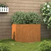 A corten steel planter with a green bush inside, placed on a lawn in front of a wooden fence. Anteprima dell’immagine prodotto