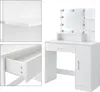 A collage showing a white vanity table with LED lights and a mirror, along with close-up views of a shelf and a drawer. Náhľad obrázku produktu