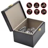 An open black Faraday box with car keys inside, with several icons indicating signal blocking. Produktbild-Vorschau