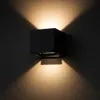 A black cube-shaped outdoor wall light mounted on a textured wall, casting light upwards and downwards. Náhľad obrázku produktu