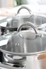 Close-up of two stainless steel pots with glass lids. Anteprima dell’immagine prodotto