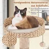 A cat is resting on a cat tree with text overlays describing its features. Náhled obrázku produktu