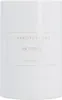 A white bottle of perfume with a gold label. Anteprima dell’immagine prodotto