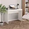 A white desk with a laptop, lamp, and plant. Podgląd zdjęcia produktu