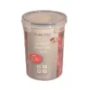 A clear studio shot of a round, clear plastic storage container with a white lid and a gray label. Produktbild-Vorschau