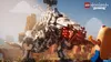 A Lego hot dog character is interacting with a large Lego mechanical dinosaur. Produktbild-Vorschau