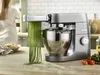 A kitchen scene with a stand mixer making pasta. Produktbild-Vorschau