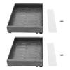 Two identical gray telescopic drawers are shown from a slightly elevated angle on a white background, with some white plastic strips and screws placed to the right of each drawer. Podgląd zdjęcia produktu