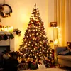 A decorated Christmas tree with presents underneath, in a cozy room setting. Produktbild-Vorschau