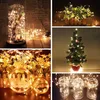 A collage of images showing various decorative uses of LED string lights, including in a glass dome, around plants, on a Christmas tree, and in jars. Produktbild-Vorschau
