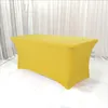 A yellow rectangular tablecloth stretched over a table, with a white curtain backdrop. Produktbild-Vorschau