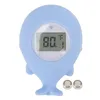A light blue baby bath thermometer shaped like a whale, displaying a temperature of 80 degrees Fahrenheit. Produktbild-Vorschau