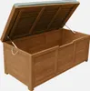 An open wooden storage chest with a green cushion on the lid. Anteprima dell’immagine prodotto