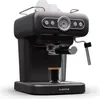 A black espresso machine with a glass of espresso in front of it, on a white background. Produktbild-Vorschau