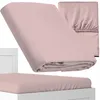 A pink fitted sheet is shown folded and on a mattress. Náhled obrázku produktu