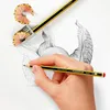 A hand is drawing a plant with pencils and a pencil sharpener. Voir les images du produit