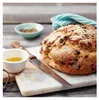 A loaf of bread with a knife and small bowls of ingredients on a wooden table. Anteprima dell’immagine prodotto