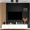 A modern living room setup with a TV, a white media console, and decorative items. Anteprima dell’immagine prodotto