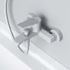 A close-up, overhead view of a white bathtub faucet mounted on a white wall. Produktbild-Vorschau