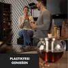 A couple enjoying tea in a modern kitchen. Produktbild-Vorschau