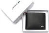 A black Lacoste wallet is presented in its white branded box. Voir les images du produit