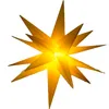 A lit, yellow star-shaped decoration. Produktbild-Vorschau