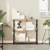 A bookshelf in a home office or study setting, with books and decorative items. Náhled obrázku produktu