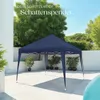 A navy blue pop-up gazebo is set up on a paved patio next to a swimming pool, with trees and a white wall in the background. Náhled obrázku produktu
