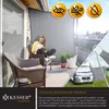 A woman is sitting on a chair on a balcony, using a tablet, with a privacy screen behind her. A camper van is visible in the lower right corner. Produktbild-Vorschau