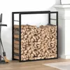 A black metal firewood rack filled with chopped wood, placed next to a white fireplace and a white wall. Náhľad obrázku produktu