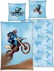 A collage of motocross-themed bedding items, featuring a large image of a motocross rider mid-air, a pillow with a motocross helmet graphic, and a smaller pillow with a motocross rider graphic. A patterned fabric is also visible. Produktbild-Vorschau