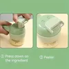 A split image showing a person using a green electric vegetable chopper and peeler, with instructional text below. Náhled obrázku produktu