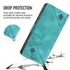 A teal flip wallet phone case is shown with text highlighting its drop protection features. The case is angled, revealing a textured surface and a magnetic closure strap. The background shows a cracked ground effect, emphasizing the drop protection. Produktbild-Vorschau