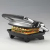 A sandwich press with a sandwich inside, shown from a front-diagonal angle. Produktbild-Vorschau