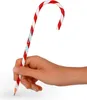 A hand holding a candy cane-shaped pencil. Anteprima dell’immagine prodotto