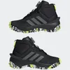 A pair of black Adidas hiking boots with gray stripes and yellow accents on a white background. Podgląd zdjęcia produktu