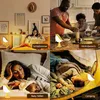 A collage of four scenes showing a bird-shaped LED night light used in different settings: a bedroom, a kitchen, a nursery, and a tent. Anteprima dell’immagine prodotto