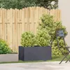 A garden scene with planters, plants, a fence, and a chair. Anteprima dell’immagine prodotto