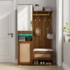 A hallway furniture set with a mirror, coat hooks, a bench, and storage compartments. Produktbild-Vorschau