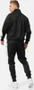 A man wearing a black tracksuit with white stripes on the side, shown from the back. Anteprima dell’immagine prodotto
