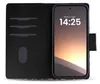 A black flip-style phone case with card slots is open, revealing a smartphone with a clock and date displayed on its screen. Produktbild-Vorschau