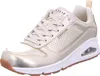A single gold SKECHERS UNO-METALLIXS sneaker is shown from a three-quarter angle against a white background. Voir les images du produit