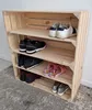 A wooden crate shoe rack with multiple shelves filled with various shoes and slippers. Náhled obrázku produktu