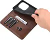 A hand is shown inserting a phone into a brown leather wallet case. The case has slots for cards and cash. Produktbild-Vorschau