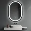 A modern bathroom vanity with a sink and an illuminated oval mirror above it. Produktbild-Vorschau