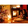 A family sits by a fireplace and a Christmas tree. Podgląd zdjęcia produktu