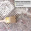 A paintbrush is placed on a white grid material, which is laid over a grey, speckled surface. Text overlays describe the product's features. Produktbild-Vorschau
