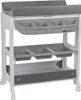 A baby changing table with integrated storage compartments and a changing pad. Produktbild-Vorschau
